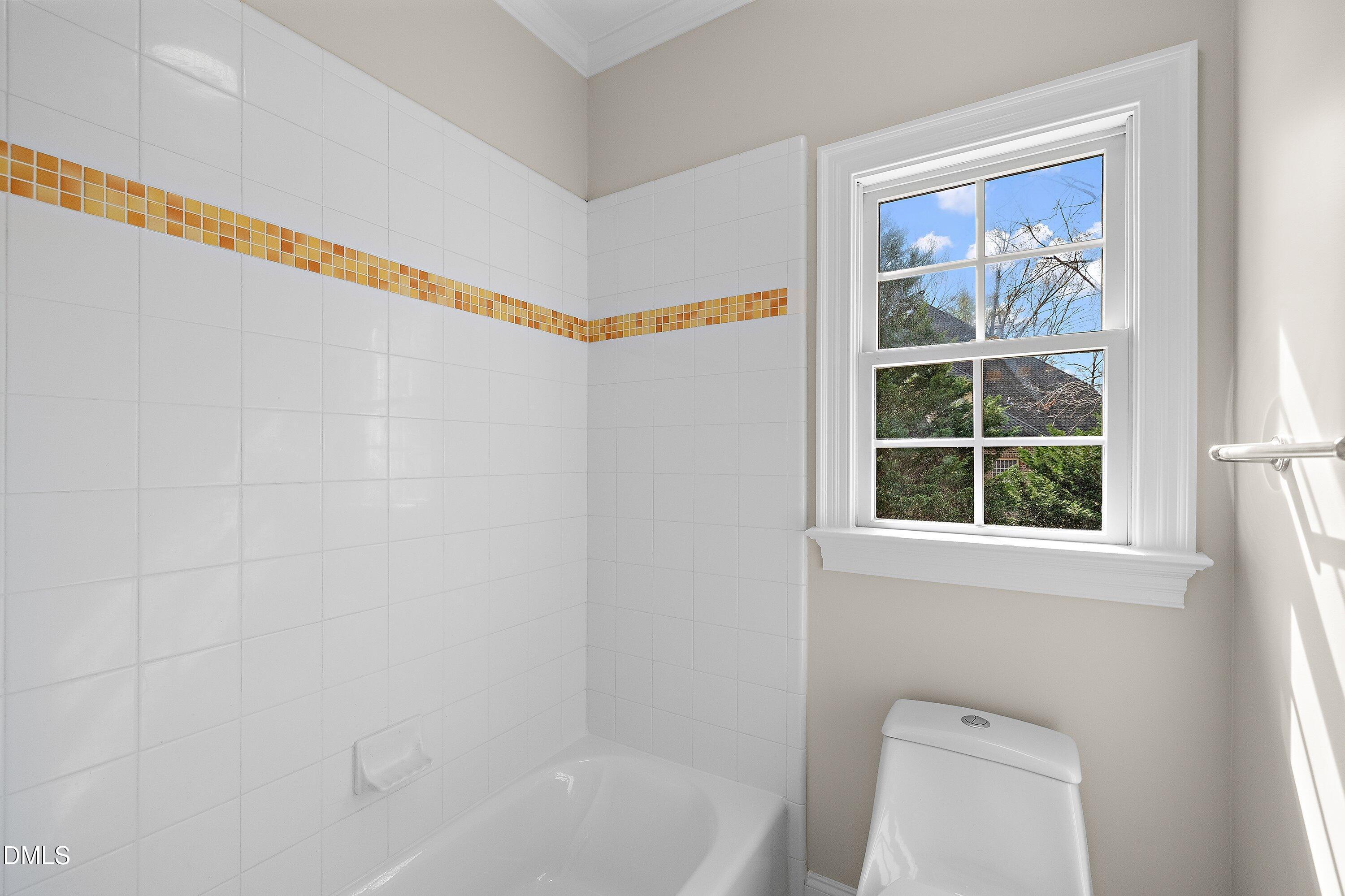 1525 Eglantyne Court Raleigh, NC 27613 - Photo 59 of 105 a bathroom with a toilet and a shower