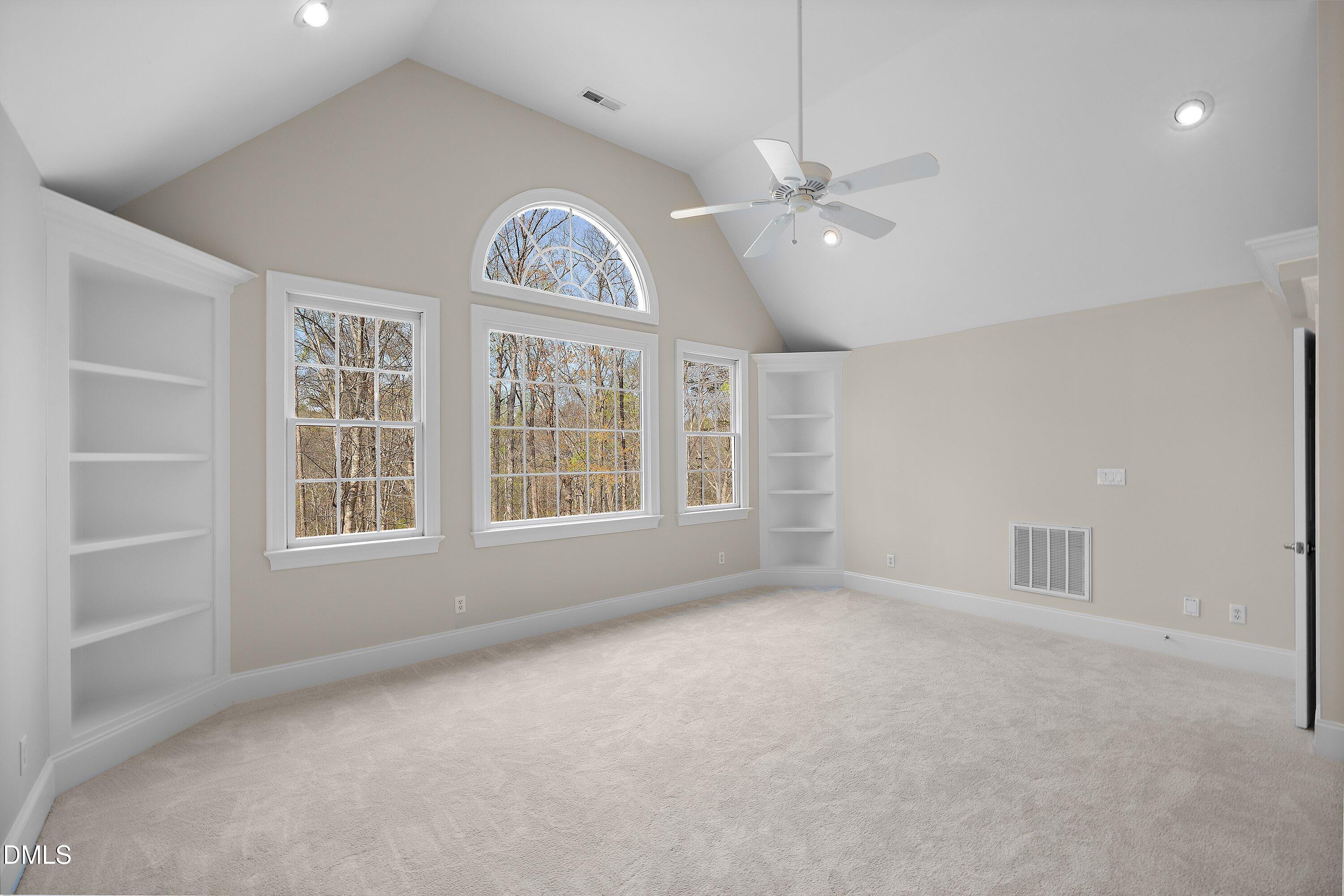 1525 Eglantyne Court Raleigh, NC 27613 - Photo 61 of 105 an empty room with windows and ceiling fan