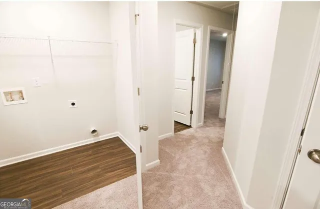 an empty room with wooden floor