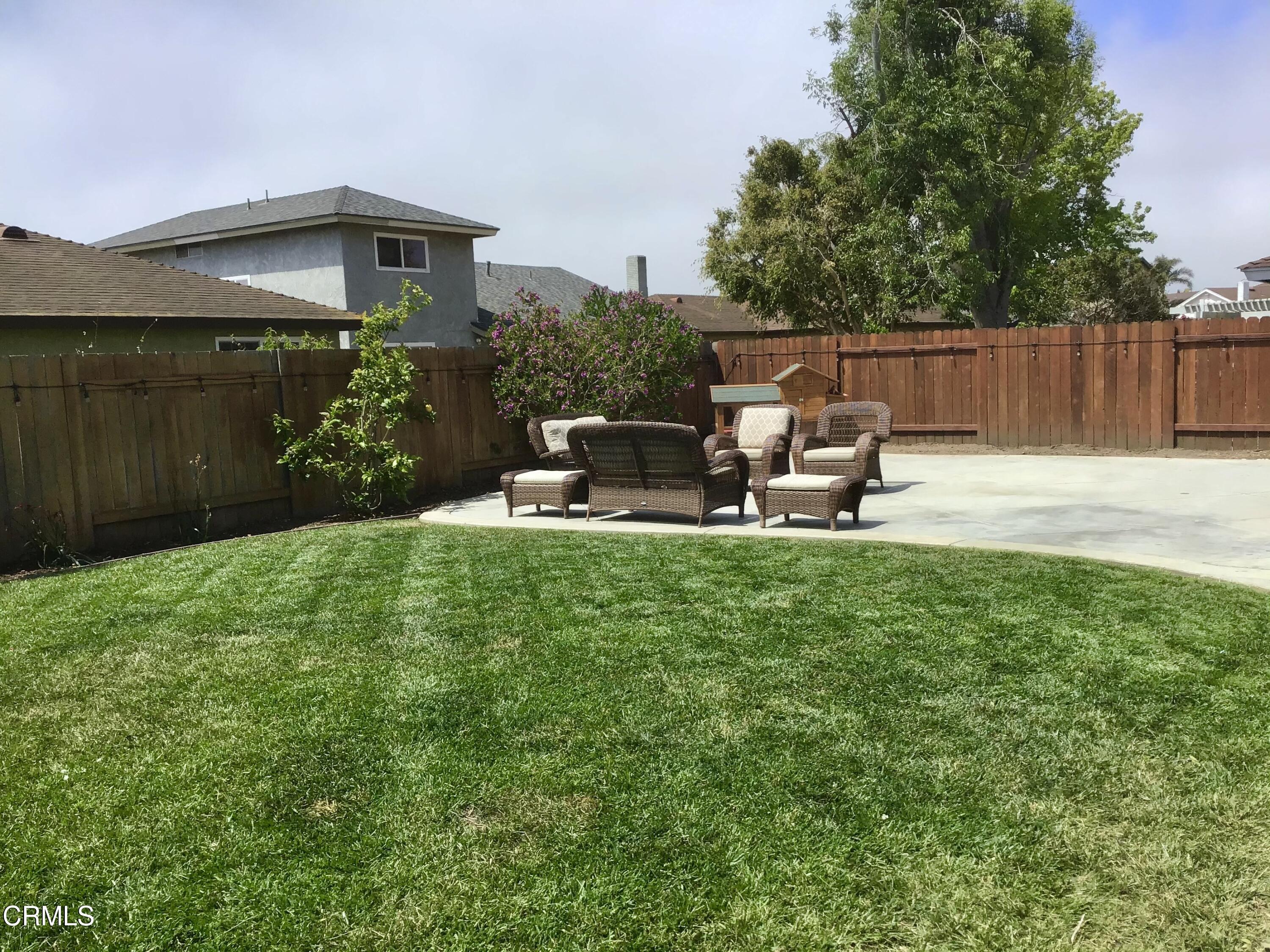 3540 Regatta Place Oxnard, CA 93035 - Photo 5 of 5 a view of a chair and table in backyard of the house