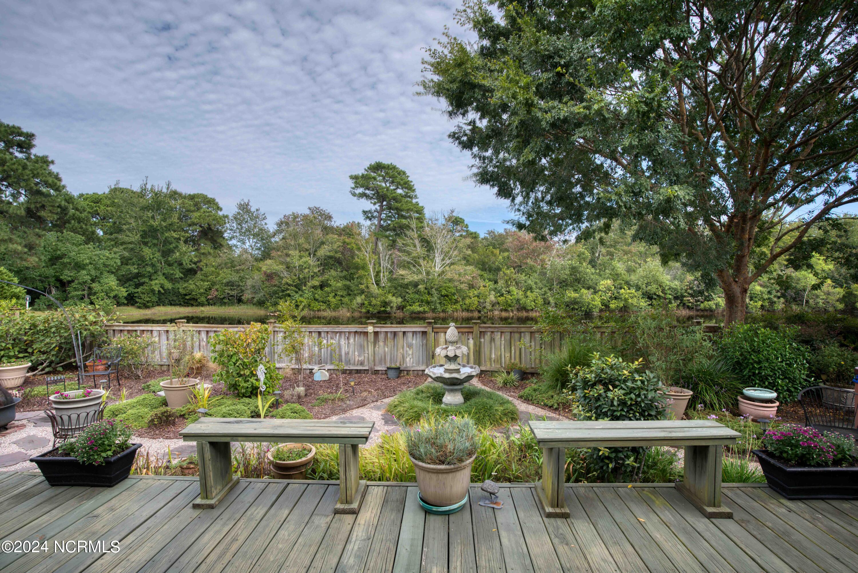 562 Tanbridge Road Wilmington, NC 28405 - Photo 60 of 72 Colorful backyard with deck & stone patio