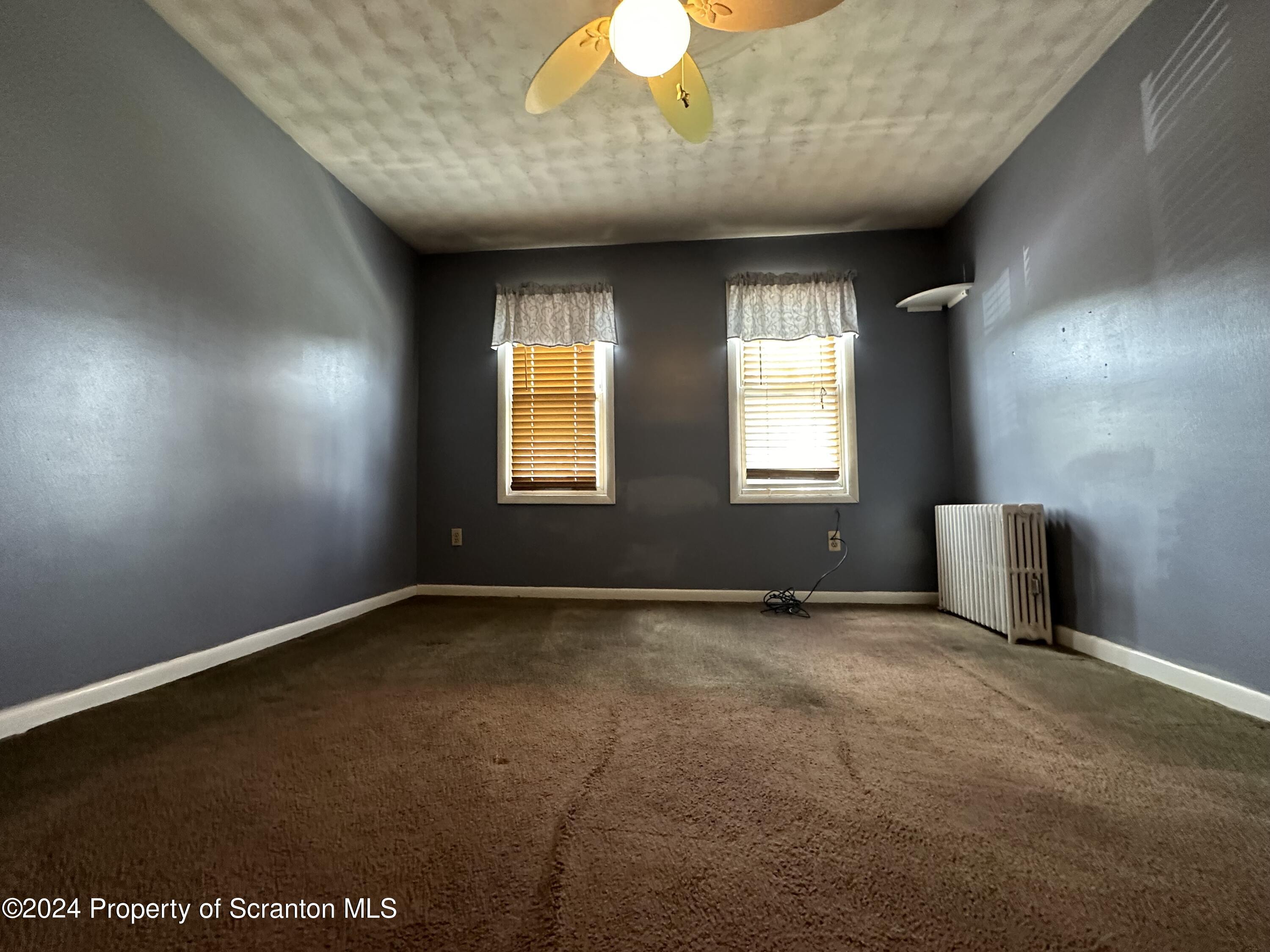 631 Cherry Street Scranton, PA 18505 - Photo 12 of 17 an empty room with windows