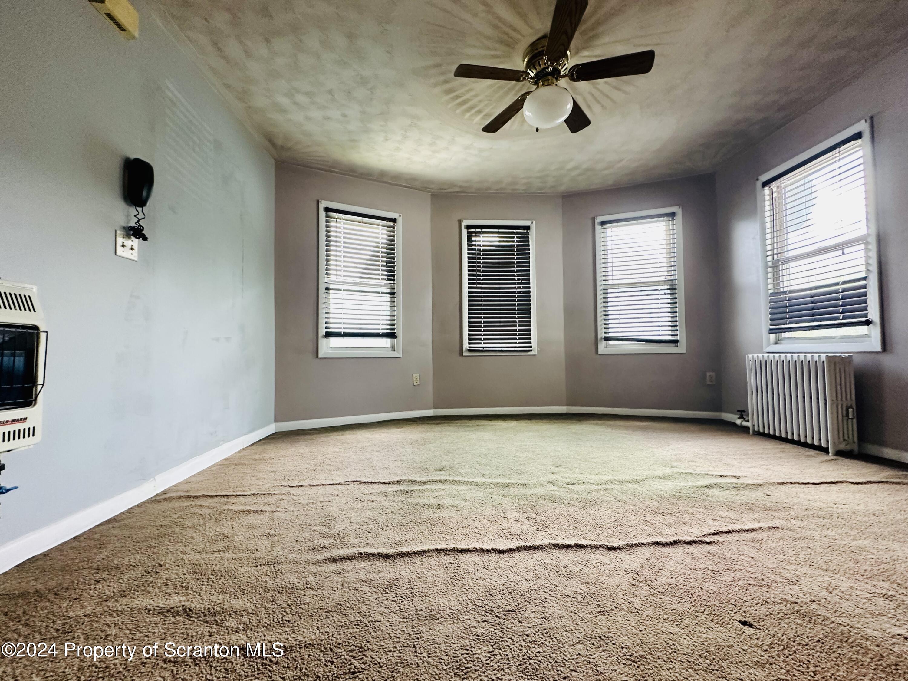 631 Cherry Street Scranton, PA 18505 - Photo 15 of 17 a view of an empty room with a window