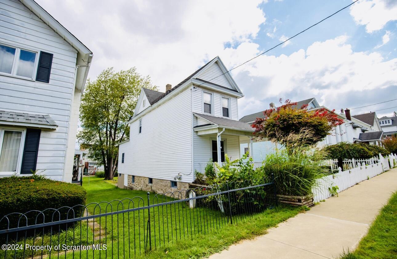 631 Cherry Street Scranton, PA 18505 - Photo 3 of 17 a front view of house and yard with green space
