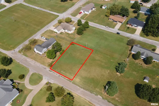 an aerial view of a house with a swimming pool