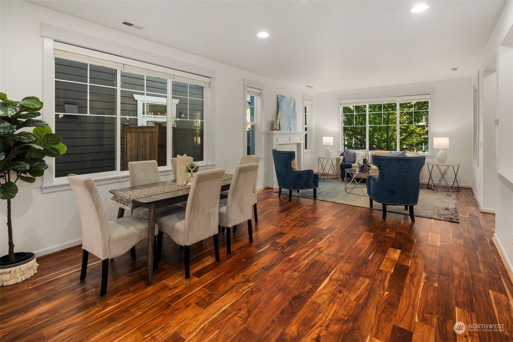 4429 186th Place Southeast Bothell, WA 98012 - Photo 11 of 37 a view of a dining room with furniture window and wooden floor