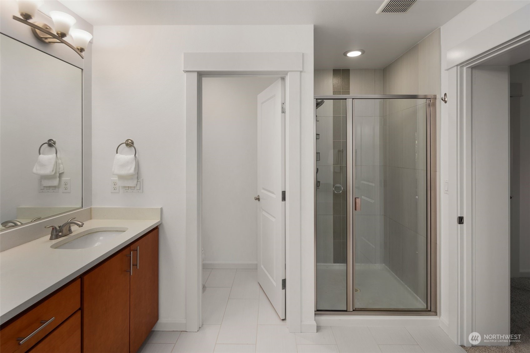 4429 186th Place Southeast Bothell, WA 98012 - Photo 25 of 37 a bathroom with a shower sink and mirror