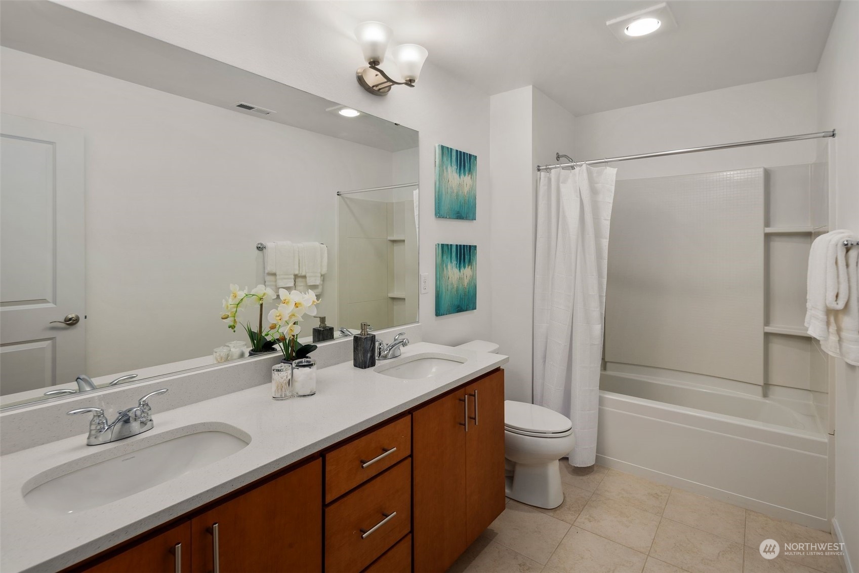 4429 186th Place Southeast Bothell, WA 98012 - Photo 29 of 37 a bathroom with a double vanity sink toilet mirror and shower