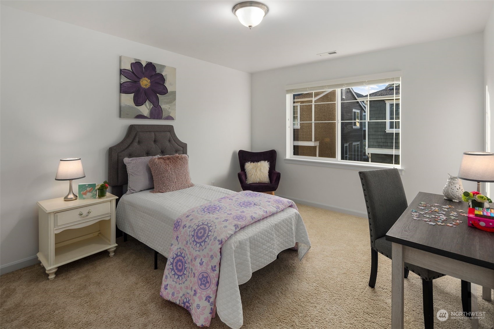 4429 186th Place Southeast Bothell, WA 98012 - Photo 30 of 37 a bedroom with a bed and a table in it