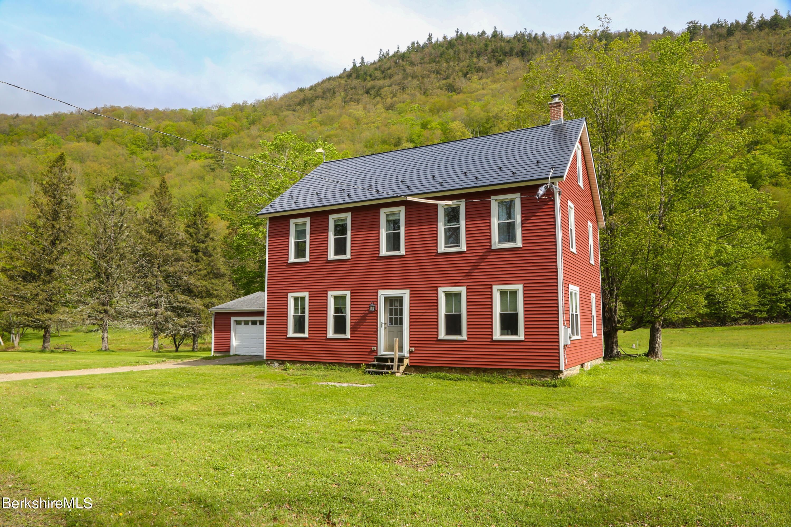 a view of a house with a garden