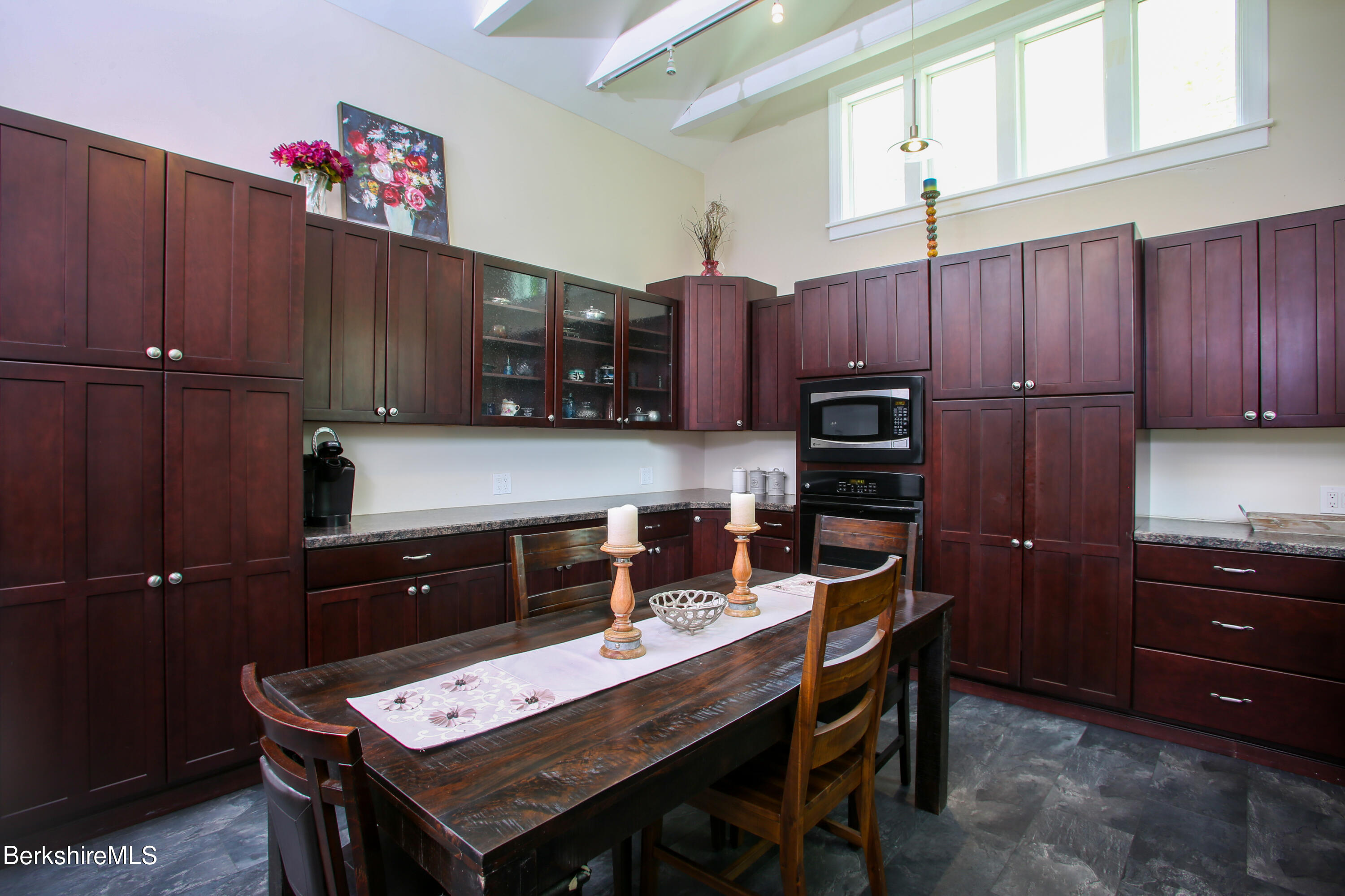 327 River Road Florida, MA 01247 - Photo 20 of 33 a kitchen with a wooden floor and cabinets