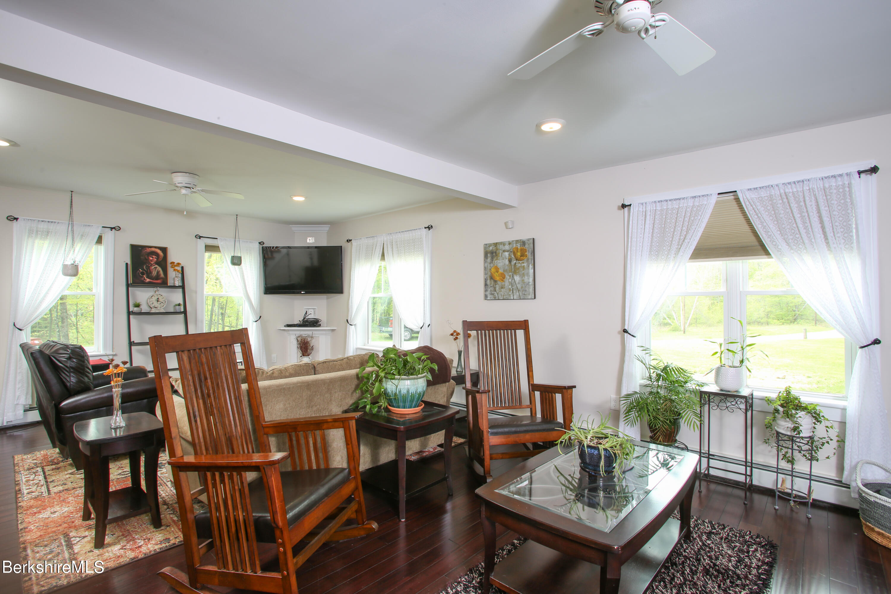 327 River Road Florida, MA 01247 - Photo 22 of 33 a living room with furniture a dining table and a potted plant