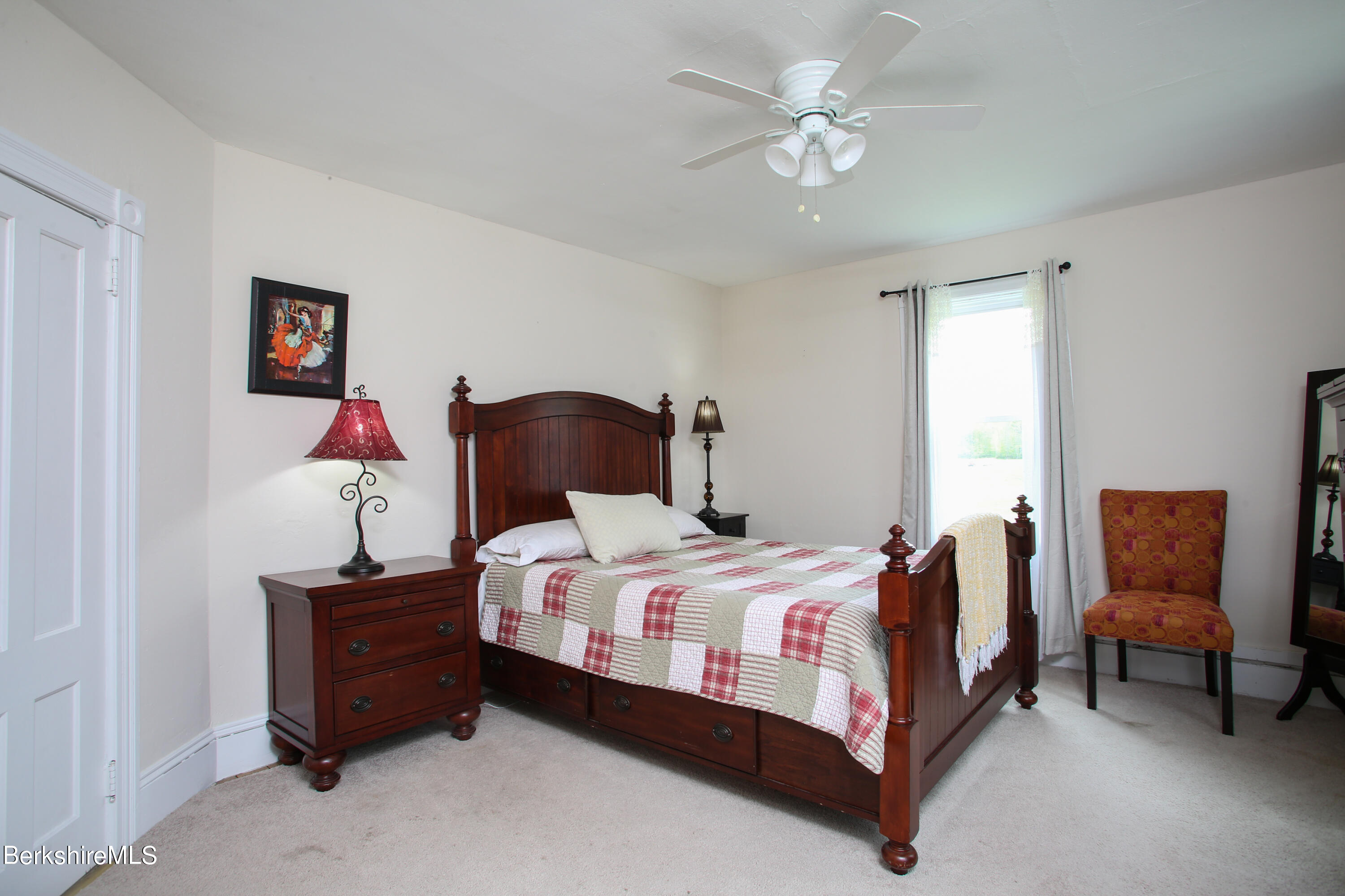 327 River Road Florida, MA 01247 - Photo 24 of 33 a bedroom with a bed and a chandelier