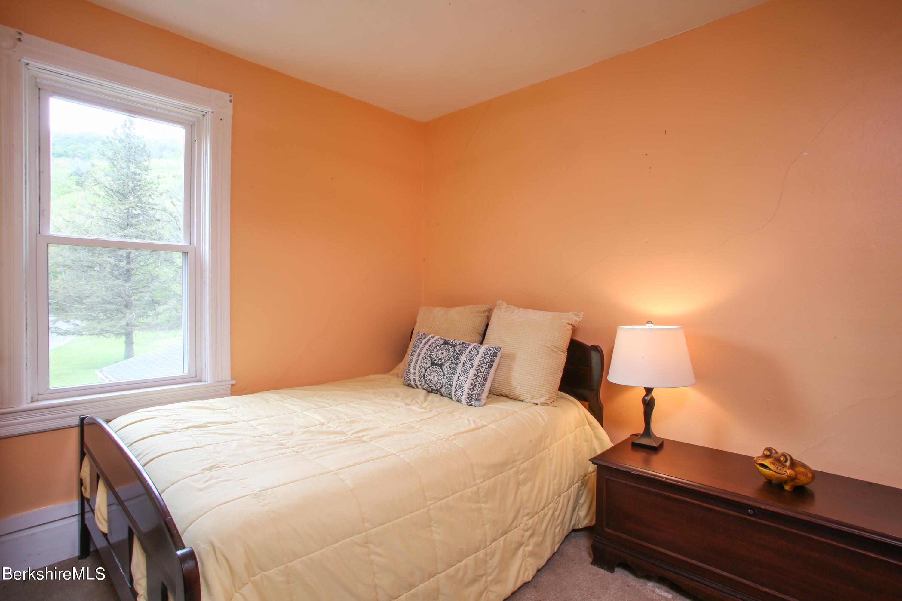 327 River Road Florida, MA 01247 - Photo 26 of 33 a bedroom with a bed and a lamp next to a window