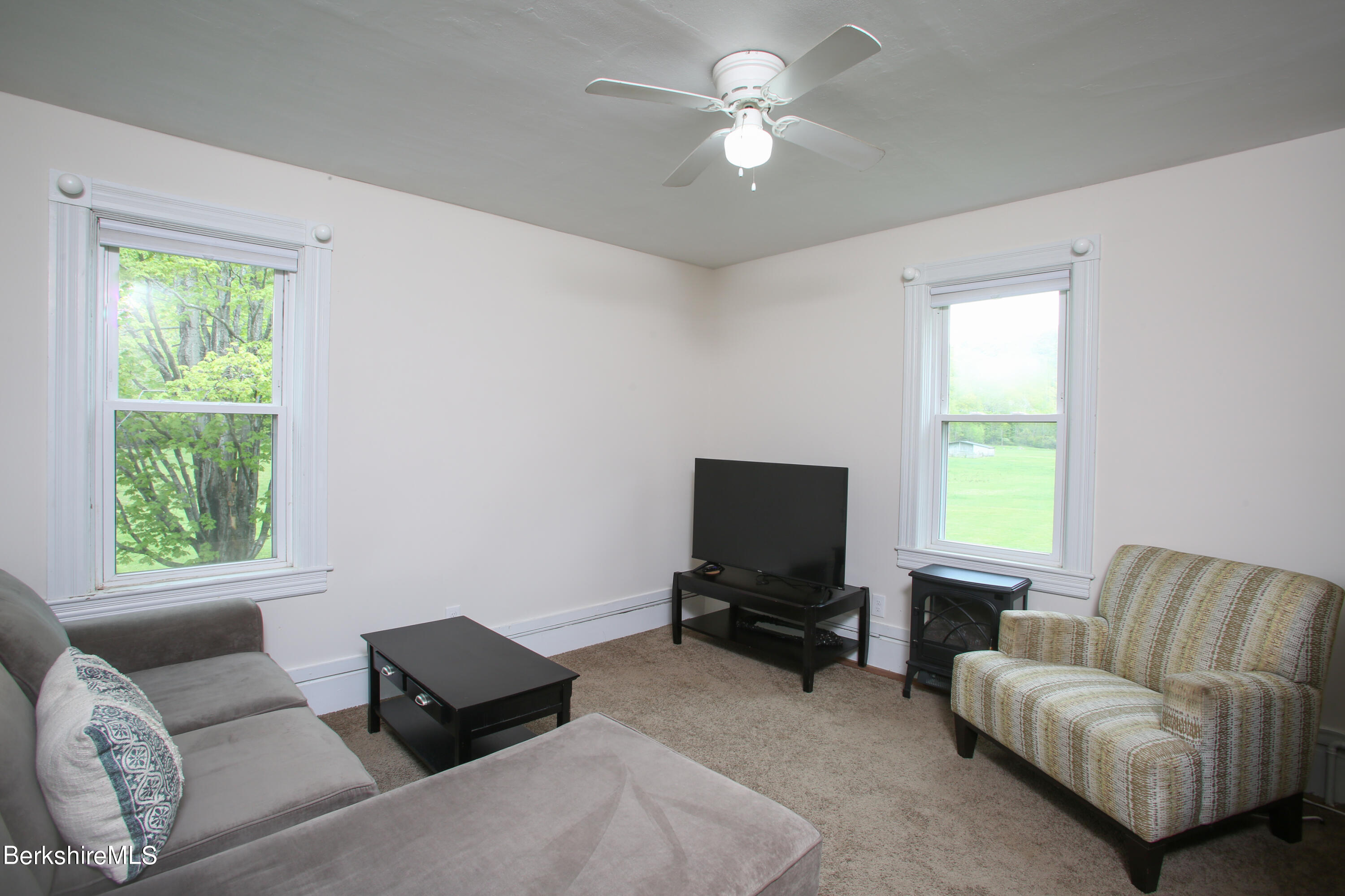 327 River Road Florida, MA 01247 - Photo 27 of 33 a living room with furniture and a window