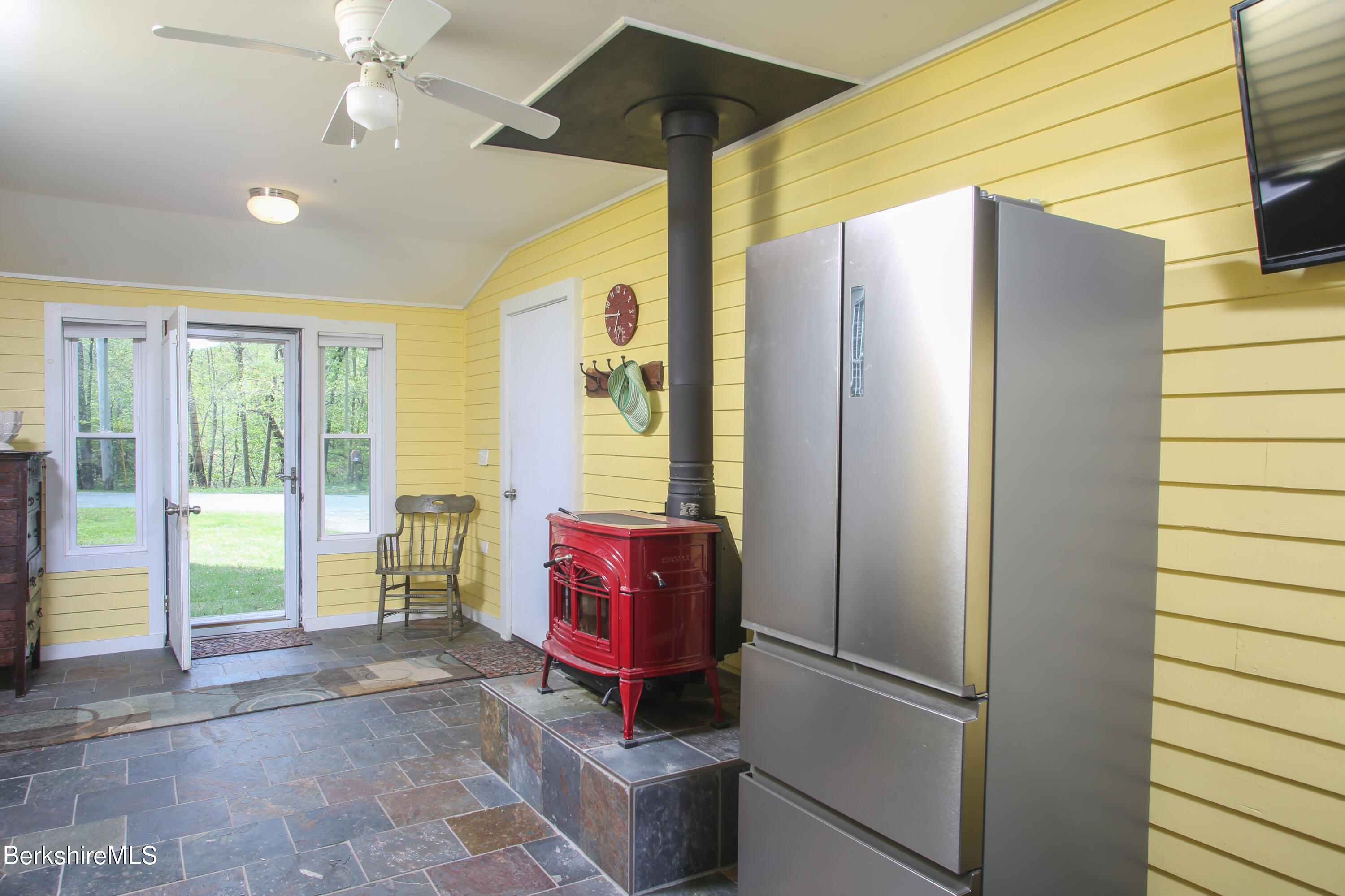 327 River Road Florida, MA 01247 - Photo 31 of 33 a living room with a couch and chandelier