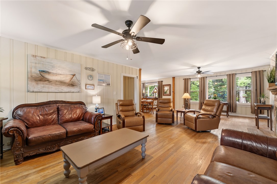 1105 Greenacres Anderson, SC 29621 - Photo 4 of 46 Step into a generously proportioned living room, graced with rich hardwood flooring and well-lit by multiple windows.