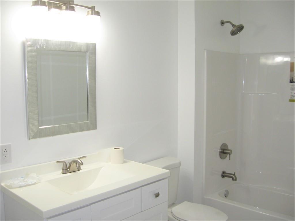 3903 Zimmerly Road Erie, PA 16506 - Photo 13 of 25 a bathroom with a sink toilet and shower