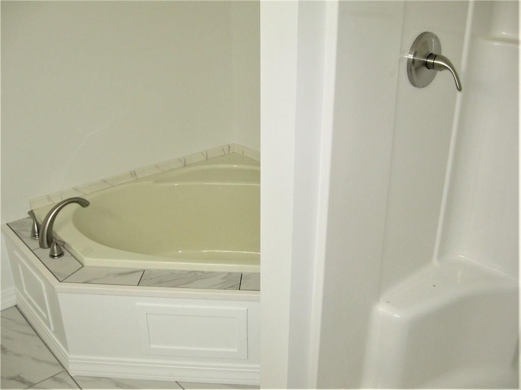 3903 Zimmerly Road Erie, PA 16506 - Photo 17 of 25 a bathroom with a bathtub
