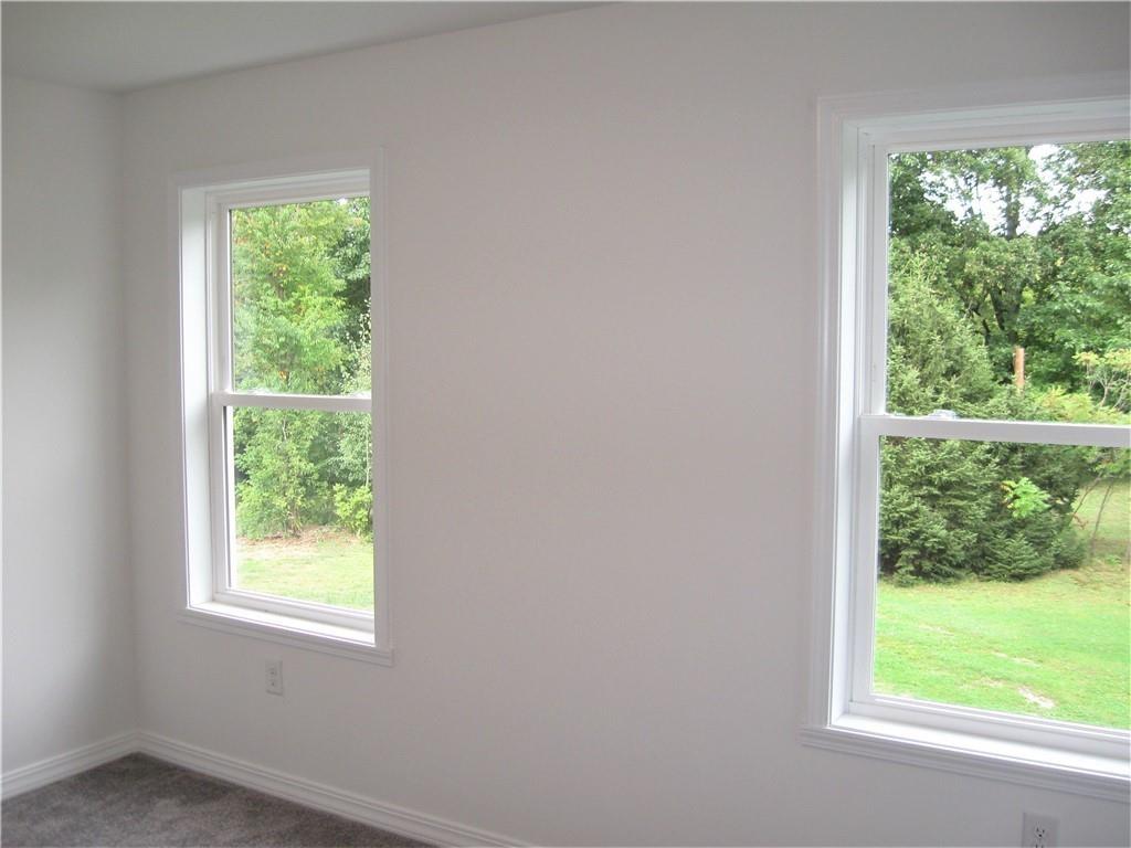 3903 Zimmerly Road Erie, PA 16506 - Photo 19 of 25 a view of a green space and a window