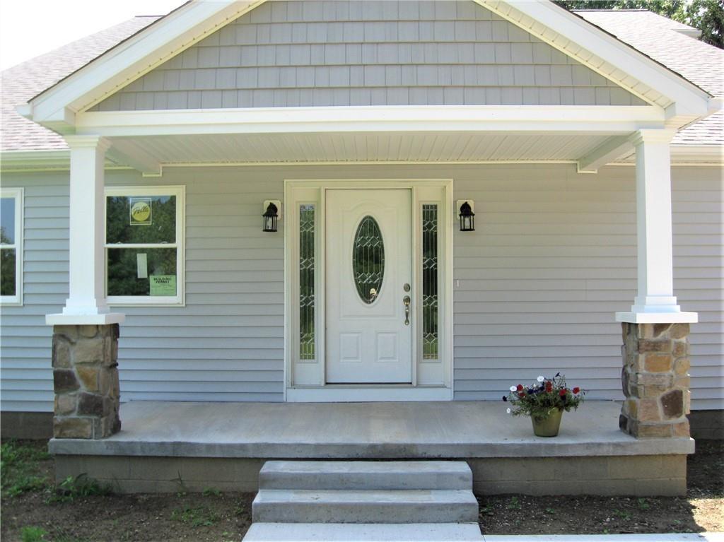 3903 Zimmerly Road Erie, PA 16506 - Photo 4 of 25 a front view of a house with potted plants