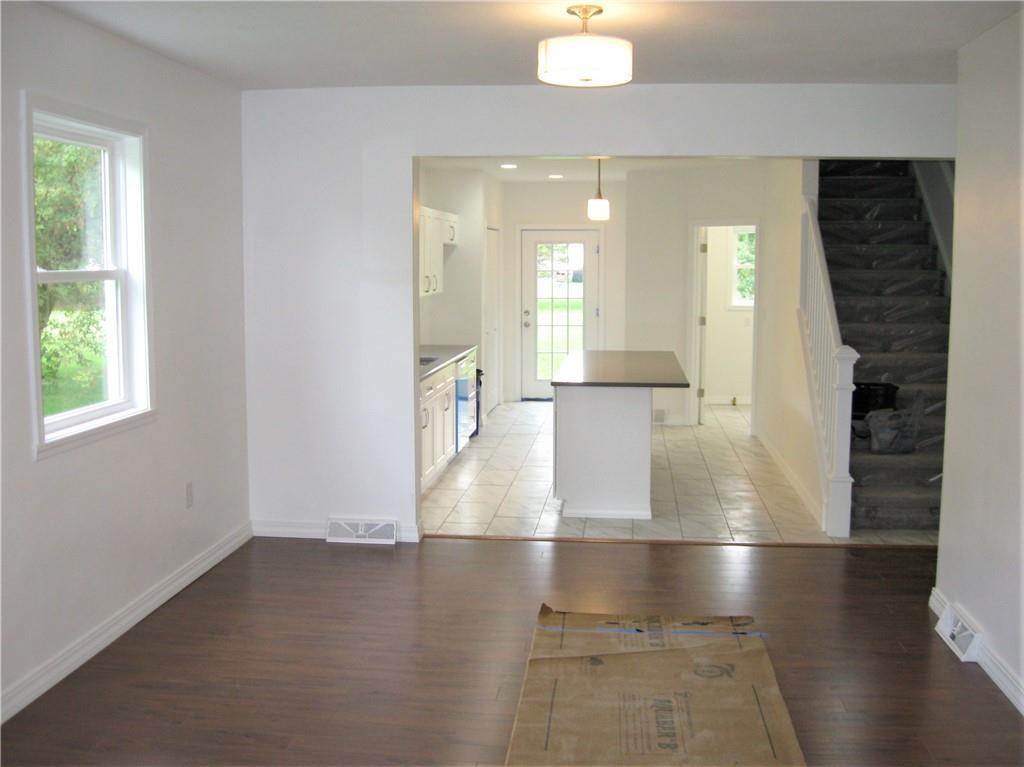 3903 Zimmerly Road Erie, PA 16506 - Photo 7 of 25 an empty room with wooden floor and windows