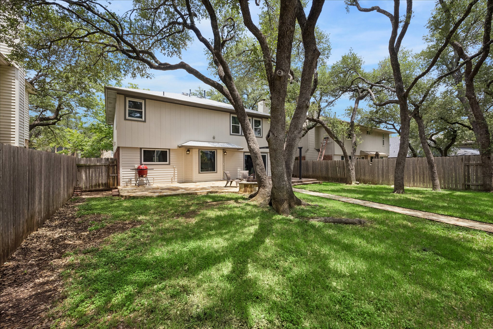 1306 Shady Grove Path Cedar Park, TX 78613 - Photo 35 of 40 a view of a house with a backyard