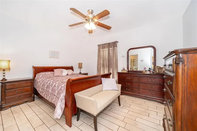 a bed room with a bed and a dresser