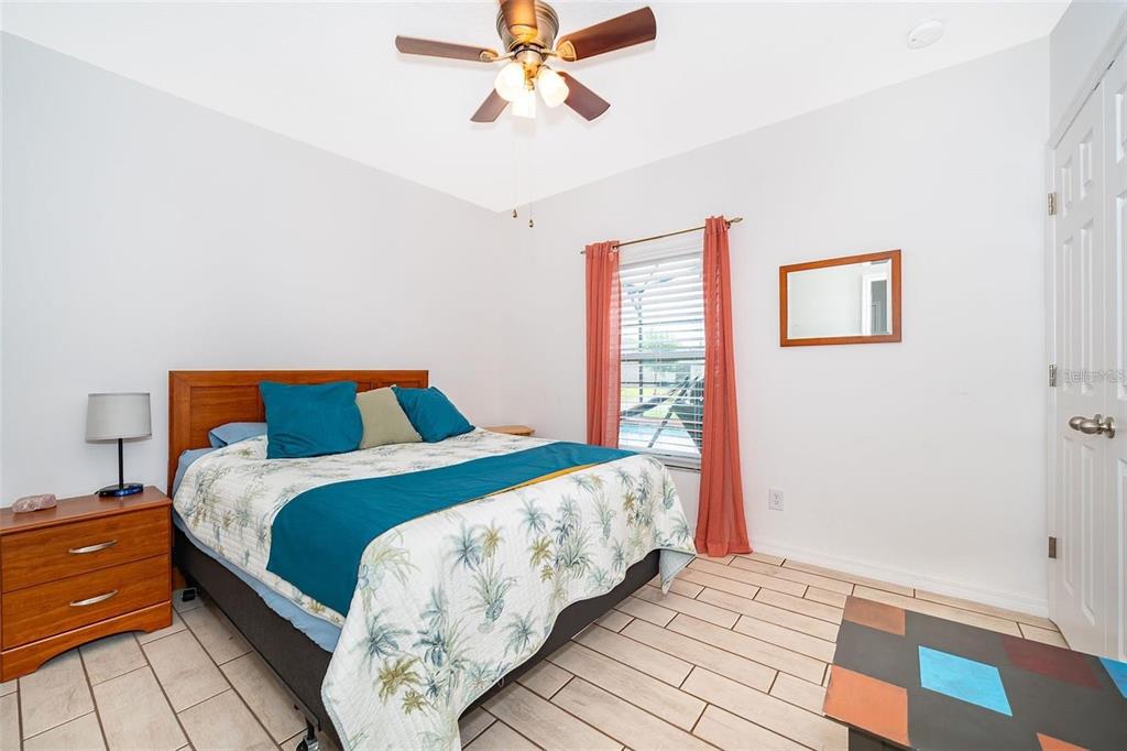 3406 Brant Street St. Cloud, FL 34772 - Photo 23 of 33 a bedroom with a bed and window