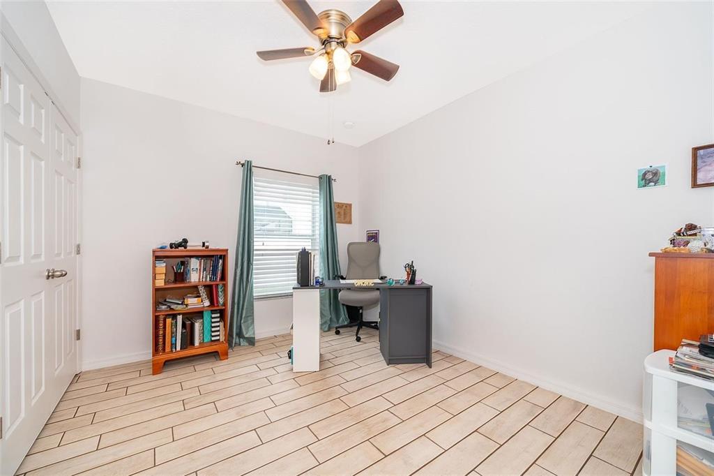3406 Brant Street St. Cloud, FL 34772 - Photo 24 of 33 a view of a workspace with furniture and a window