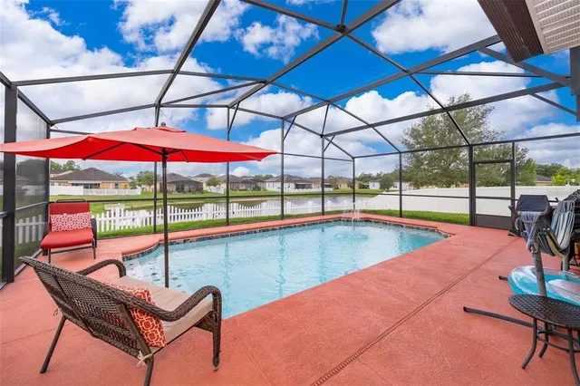 a view of a indoor swimming pool with a patio