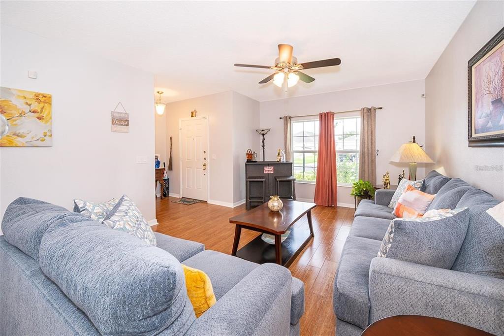 3406 Brant Street St. Cloud, FL 34772 - Photo 10 of 33 a living room with furniture and a large window