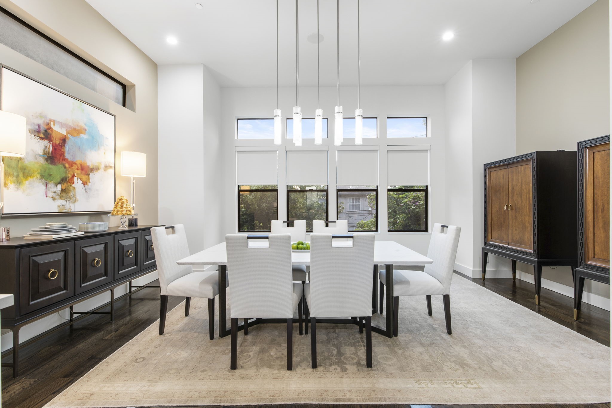 205 Portland Street Houston, TX 77006 - Photo 12 of 36 a view of a dining room with furniture wooden floor and chandelier