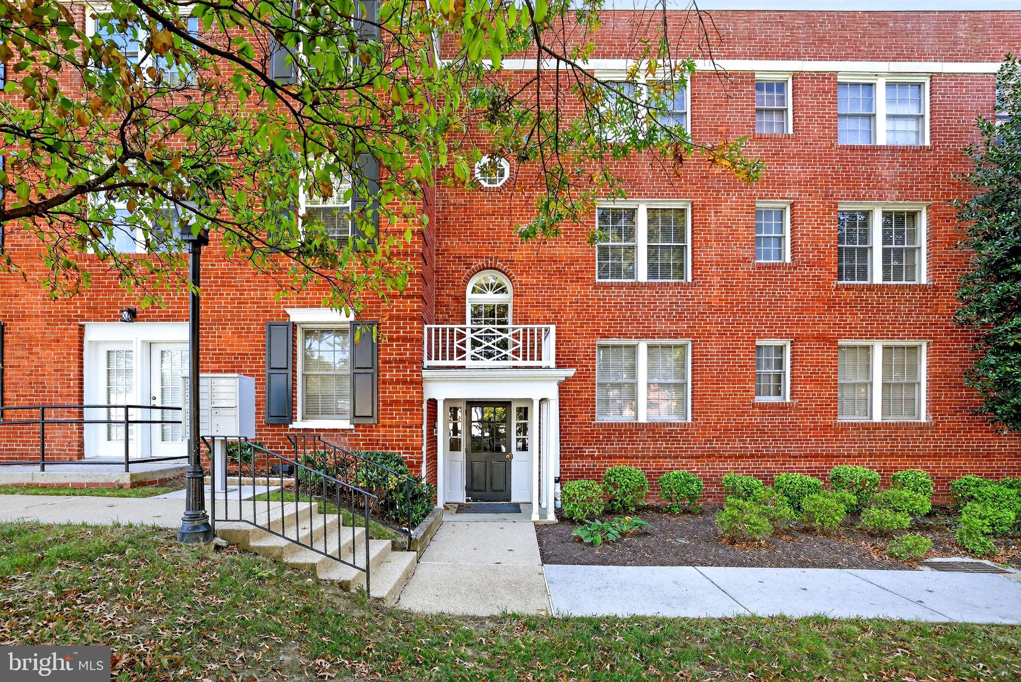 500 Bashford Lane, Unit 3321 Alexandria, VA 22314 - Photo 15 of 20 a front view of a brick house with a yard