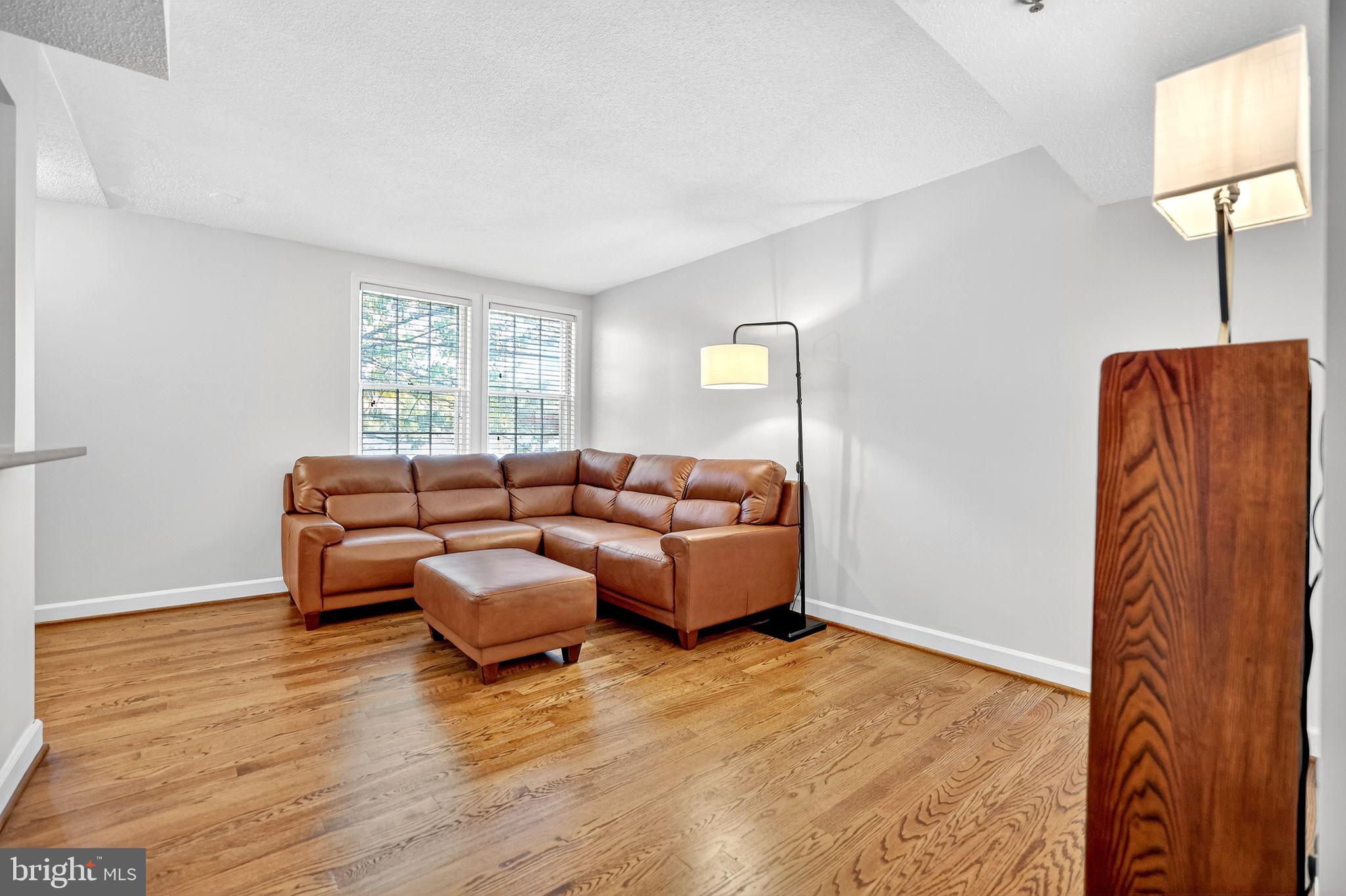 500 Bashford Lane, Unit 3321 Alexandria, VA 22314 - Photo 7 of 20 a living room with furniture and a window