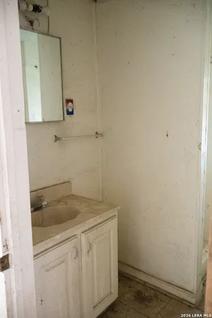 a bathroom with a sink and vanity