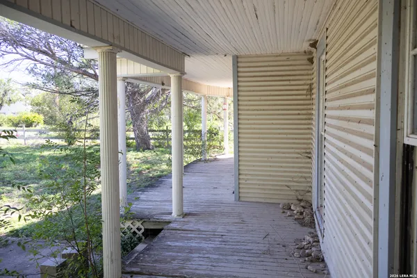 a view of a house with small yard and plants