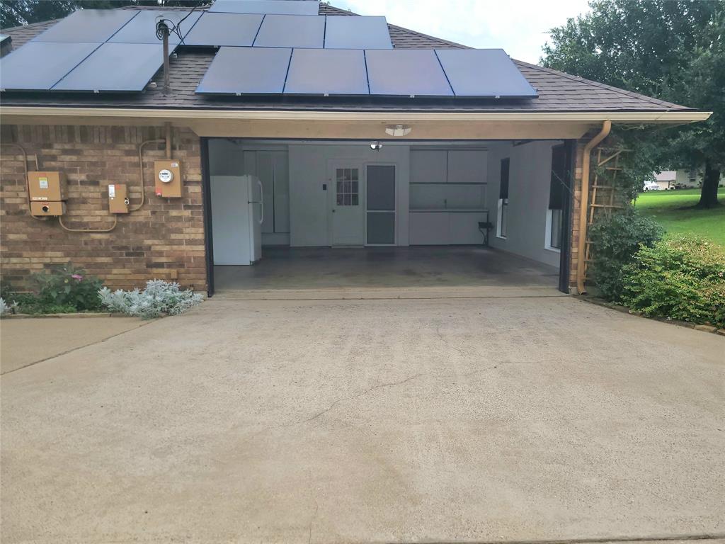 912 North Dove Road Grapevine, TX 76051 - Photo 35 of 36 a view of a patio with table and chairs under an umbrella