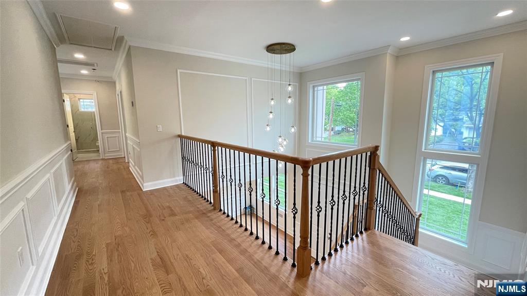 405 Valley Road River Edge, NJ 07661 - Photo 11 of 20 a view of a hallway view with wooden floor and staircase