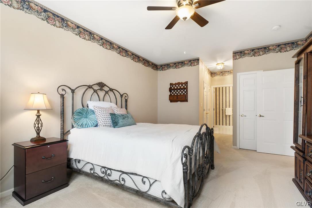 1882 Gregory Place Hellertown, PA 18055 - Photo 15 of 28 a bedroom with a bed and a chandelier