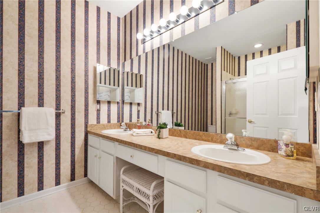 1882 Gregory Place Hellertown, PA 18055 - Photo 16 of 28 a bathroom with a double vanity sink and a mirror