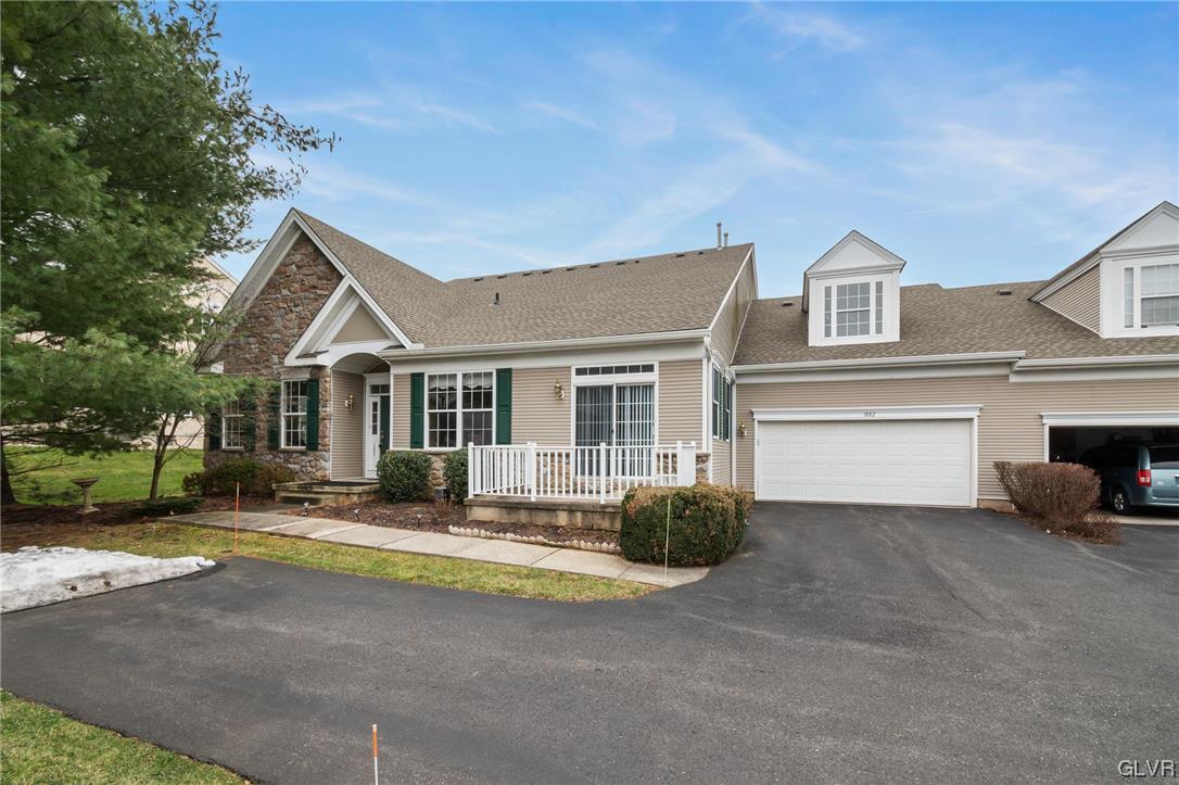 1882 Gregory Place Hellertown, PA 18055 - Photo 3 of 28 a front view of a house with a yard and potted plants