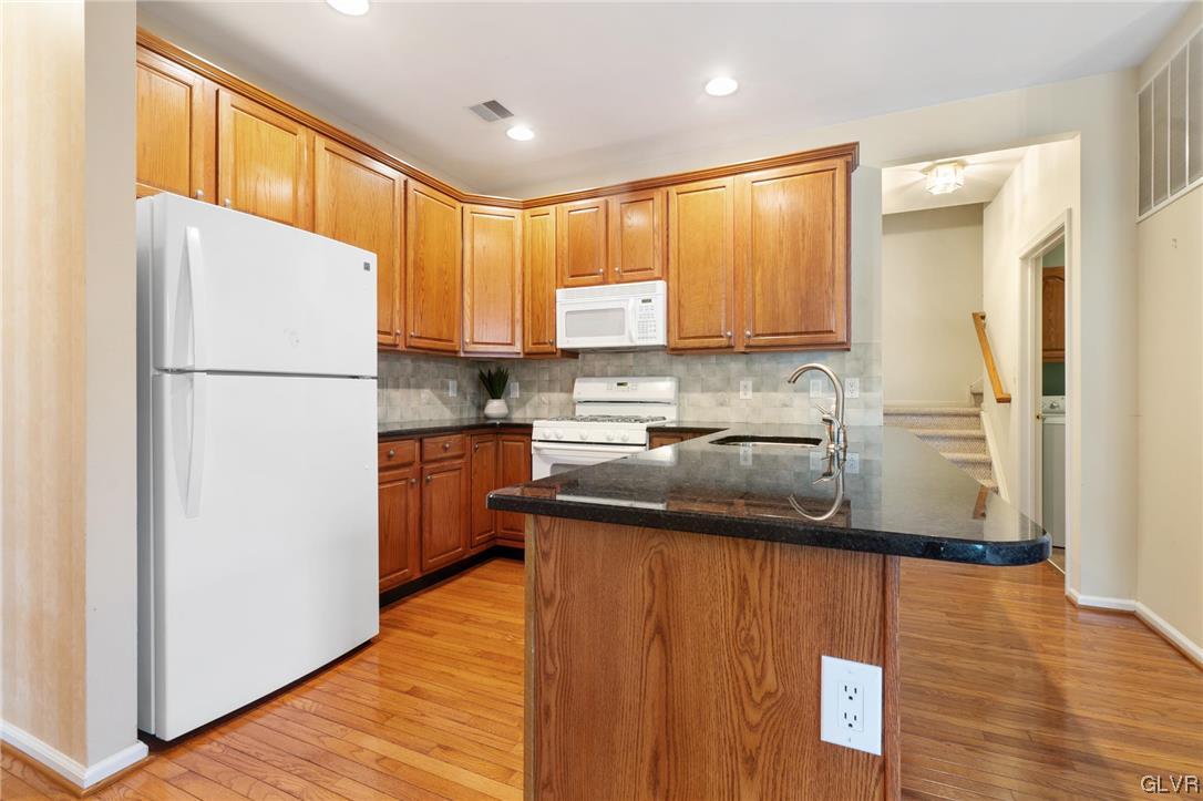 1882 Gregory Place Hellertown, PA 18055 - Photo 8 of 28 a kitchen with a refrigerator sink and cabinets