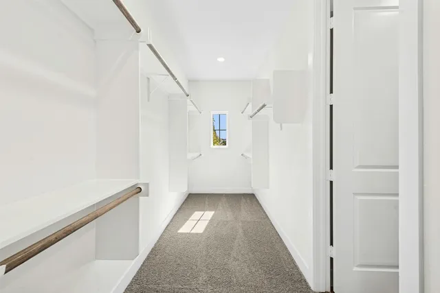 a view of a hallway with windows