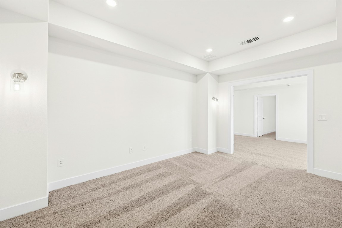 1520 Rodeo Ridge Drive Georgetown, TX 78628 - Photo 17 of 29 Carpeted empty room featuring recessed lighting