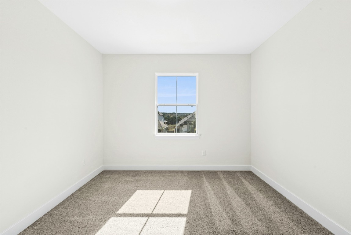 1520 Rodeo Ridge Drive Georgetown, TX 78628 - Photo 21 of 29 Empty room with light carpet