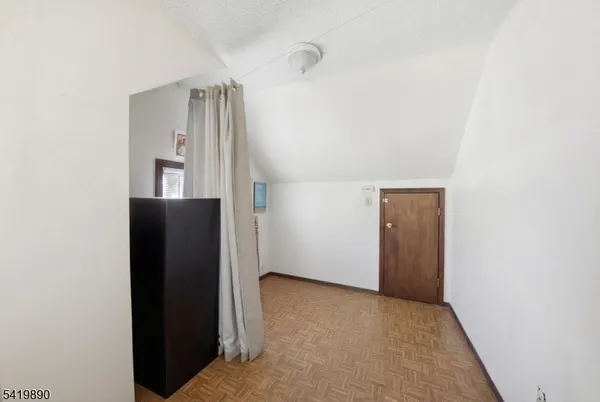 a view of hallway with cabinets