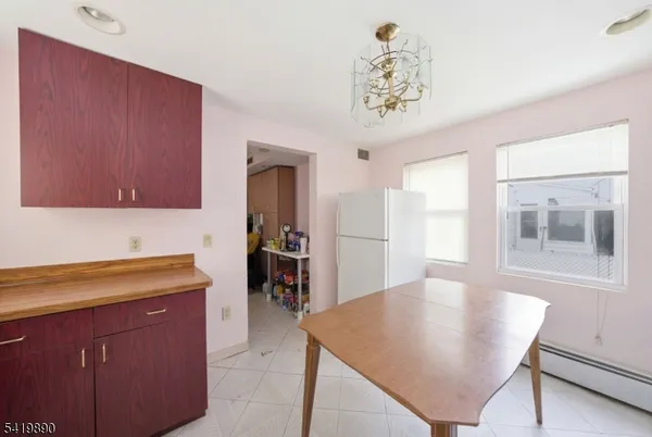 a kitchen with a table and chairs