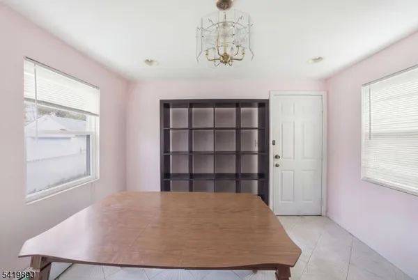 a view of wooden floor and windows in a room