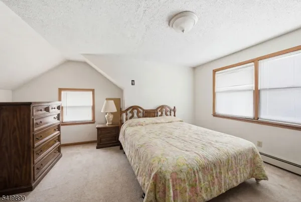 a bed room with a bed and a window